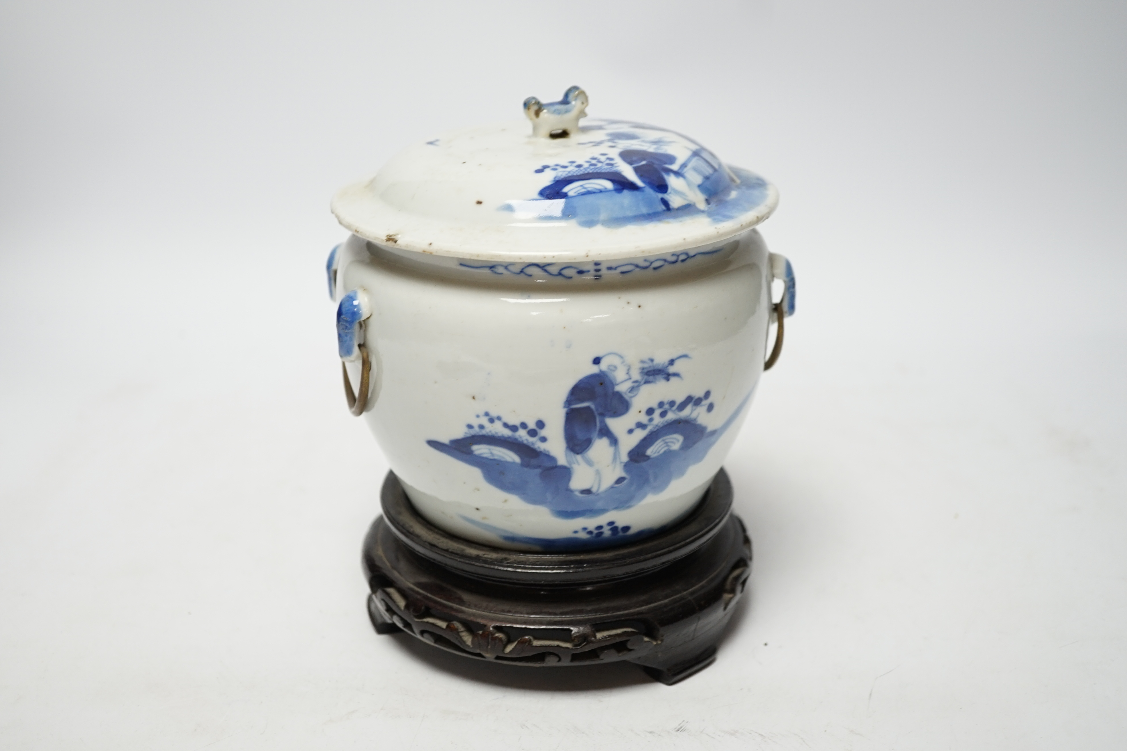 A Chinese Straits blue and white bowl and cover, kamcheng, late 19th century, with twin handles, on hardwood stand, 19cm high